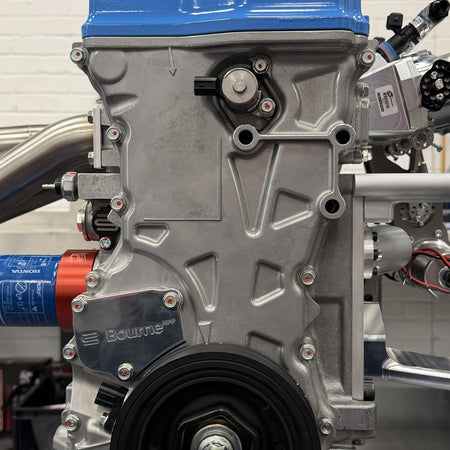 A Bourne HPP billet timing chain tensioner cover on the side of Bourne's K20R engine spec.