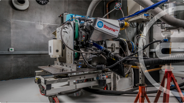 Industrial machine with 'Bourne' branding in a workshop setting
