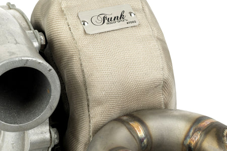 Inside view of Funk Motorsport Audi RS3 8V turbo blanket, designed for Audi A3, S3, and RS3 turbochargers, highlighting heat insulation material.