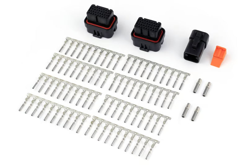 Haltech Nexus R3 VCU with plug and pin set for universal vehicle control, shown with wiring connectors and electronic components.