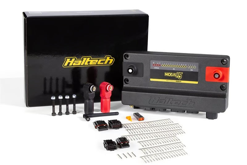 Haltech Nexus R5 universal ECU with plug and pin set, showing wiring and connector components for automotive tuning.
