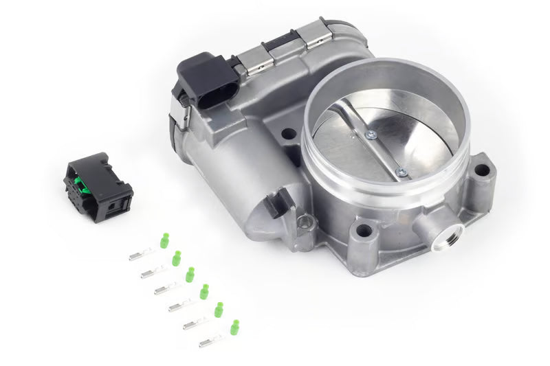 Haltech Bosch 74mm electronic throttle body with connector and pins, showcasing the sleek metal body and mounting components.