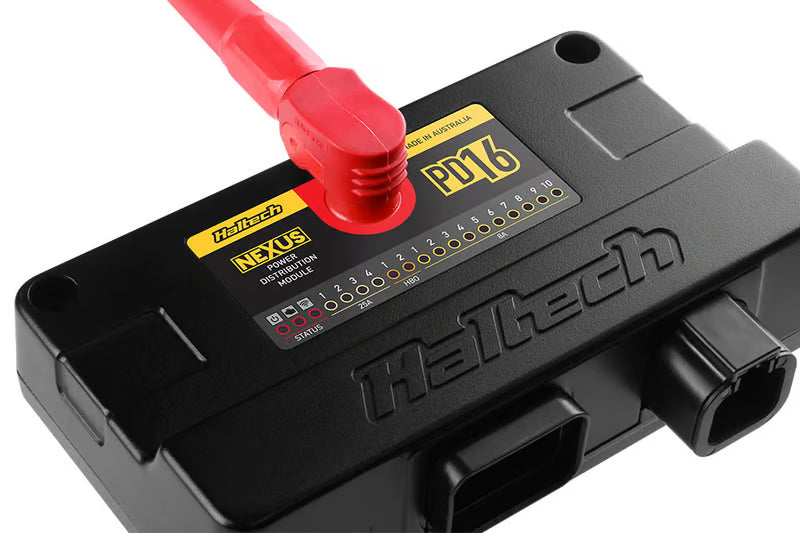 Haltech PD16 PDM electronic power distribution module with multiple connectors and control interface.