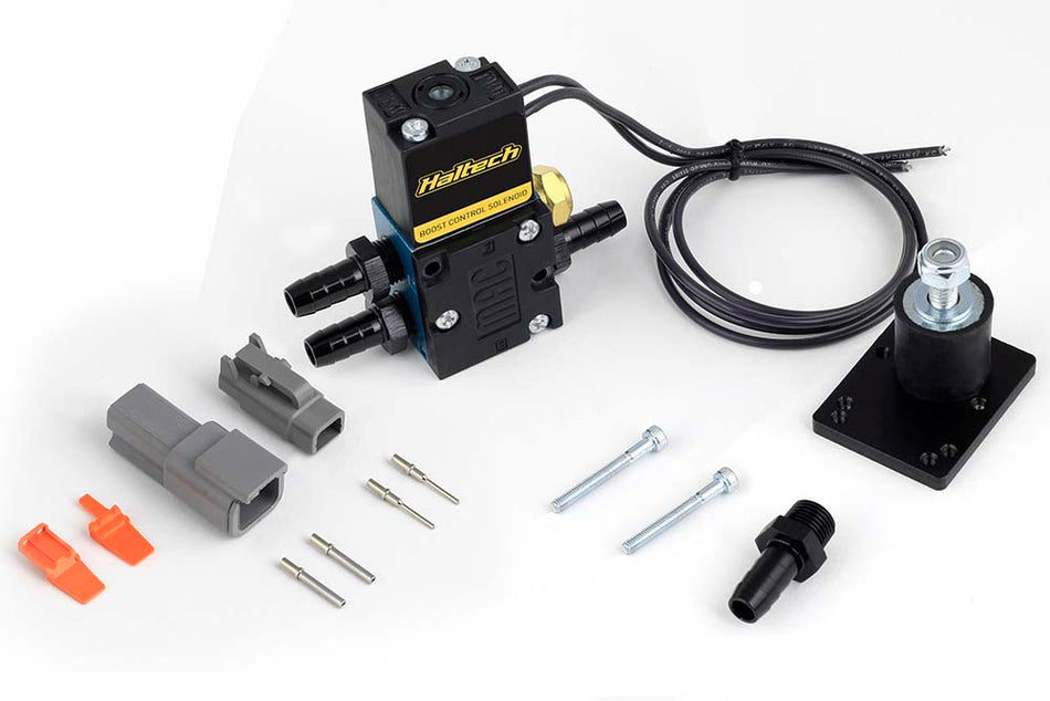 Haltech 4-port boost control solenoid sensor for turbo systems, showing the compact electronic component with ports and wiring.