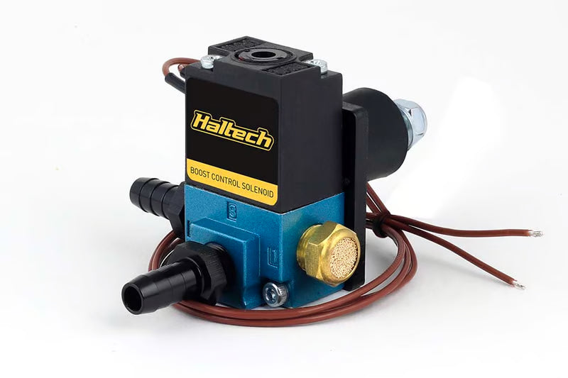 Haltech 3-port boost control solenoid sensor mounted with hoses and wiring for turbocharger boost management.