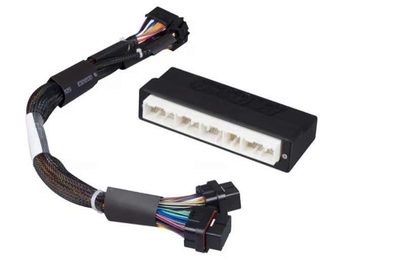 Haltech Elite 1500 plug 'n' play wiring harness adapter for Honda EP3, shown with connectors and wiring components.