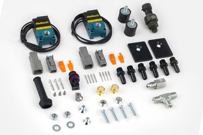 Haltech CO2 Boost Control Dual Solenoid and Pressure Sensor Kit with electronic components and wiring for turbocharged vehicles