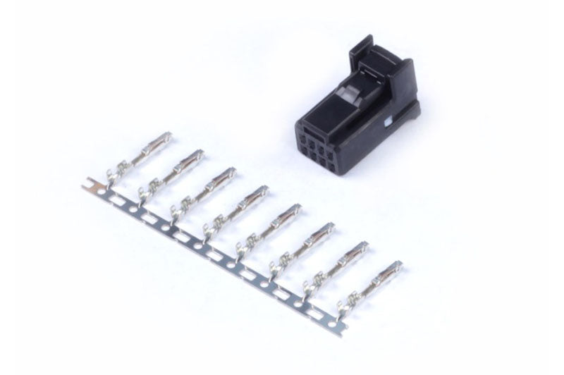 Black Haltech 8-pin TYCO plug and pins accessory, close-up of the electrical connector components.