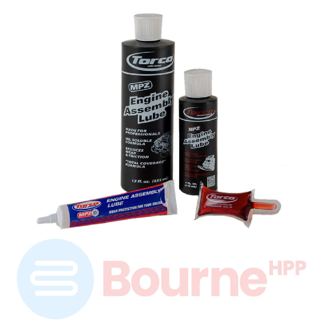 Two bottles of Torco MPZ Engine Assembly Lube, one large and one small, with a red-colored tube also visible, all branded and with the Torco logo on the labels.