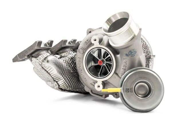 Funk Motorsport Borg Warner TTE700 turbo blanket on a turbocharger for Audi RS3 8V and TTRS engines, showing heat-resistant material.